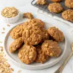 No bake peanut butter oatmeal cookies cooling on parchment paper — chewy, creamy, and packed with oats. A quick no-bake recipe perfect for kids and no-oven baking days.